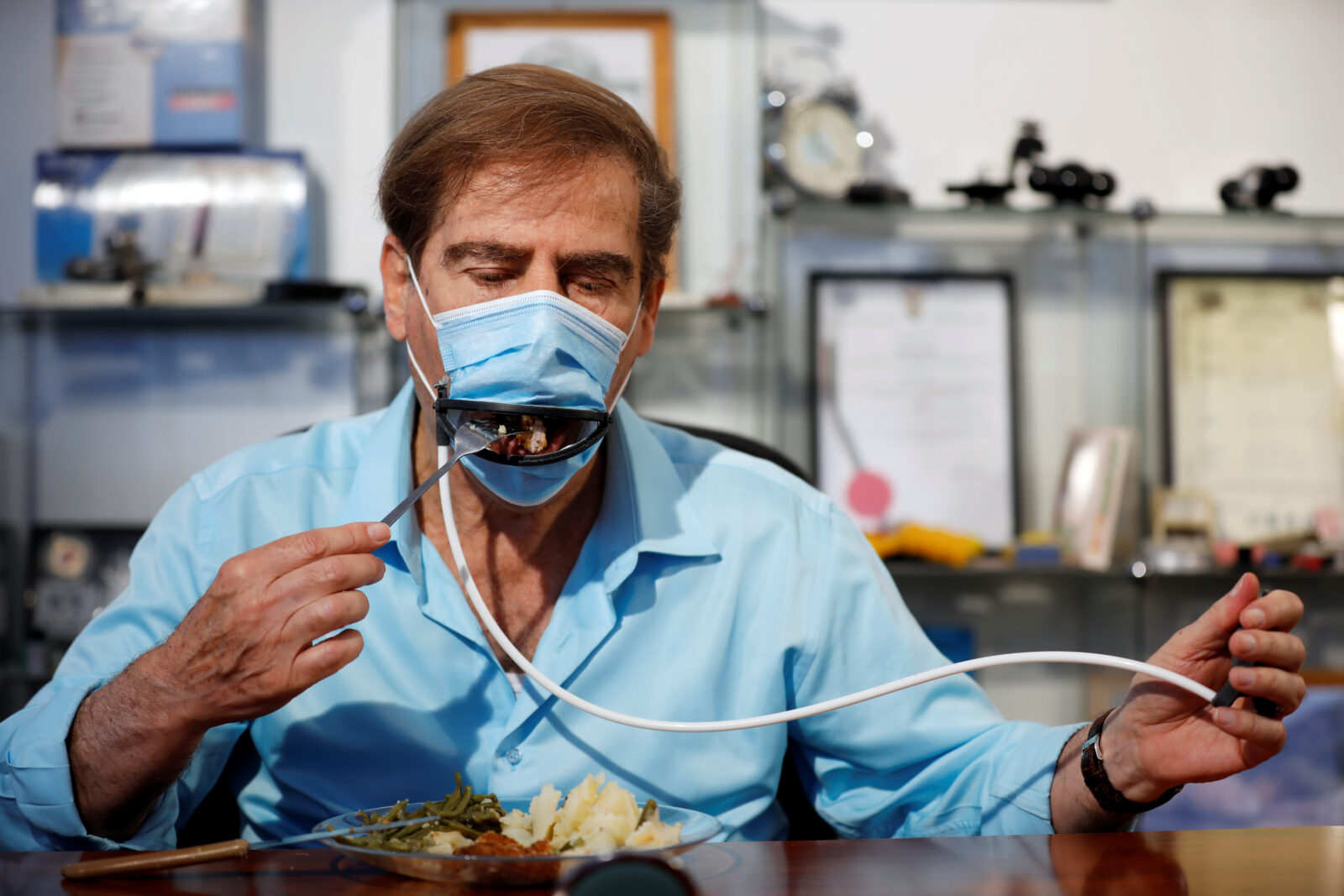 Israeli inventors develop a mask that allows diners to eat food without taking it off in Or Yehuda