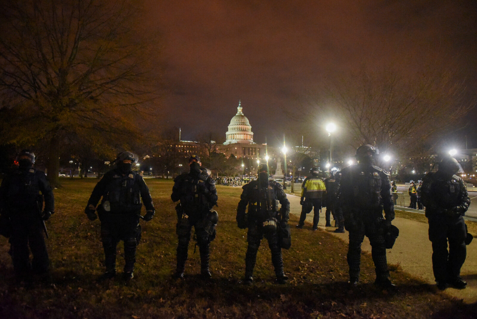 FILE PHOTO: Security forces stand guard as the surroundings of the U.S. Capitol are empty during a curfew in Washington