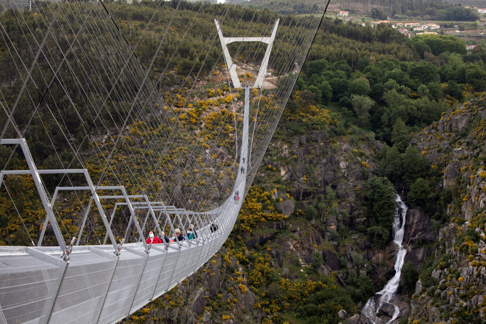 People walk on the world's longest pedestrian suspension bridge '516 Arouca', in Arouca