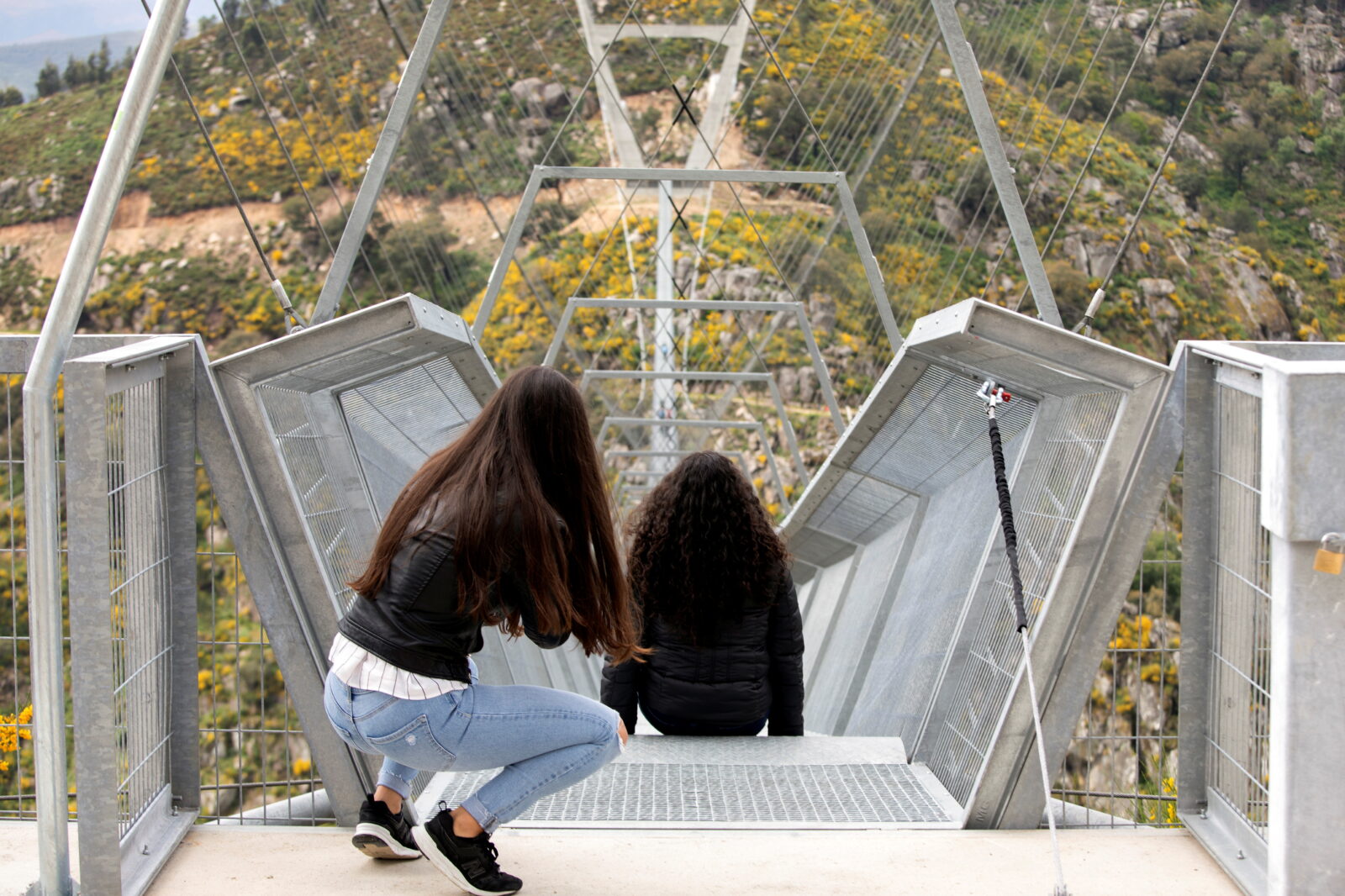 People walk on the world's longest pedestrian suspension bridge '516 Arouca', in Arouca