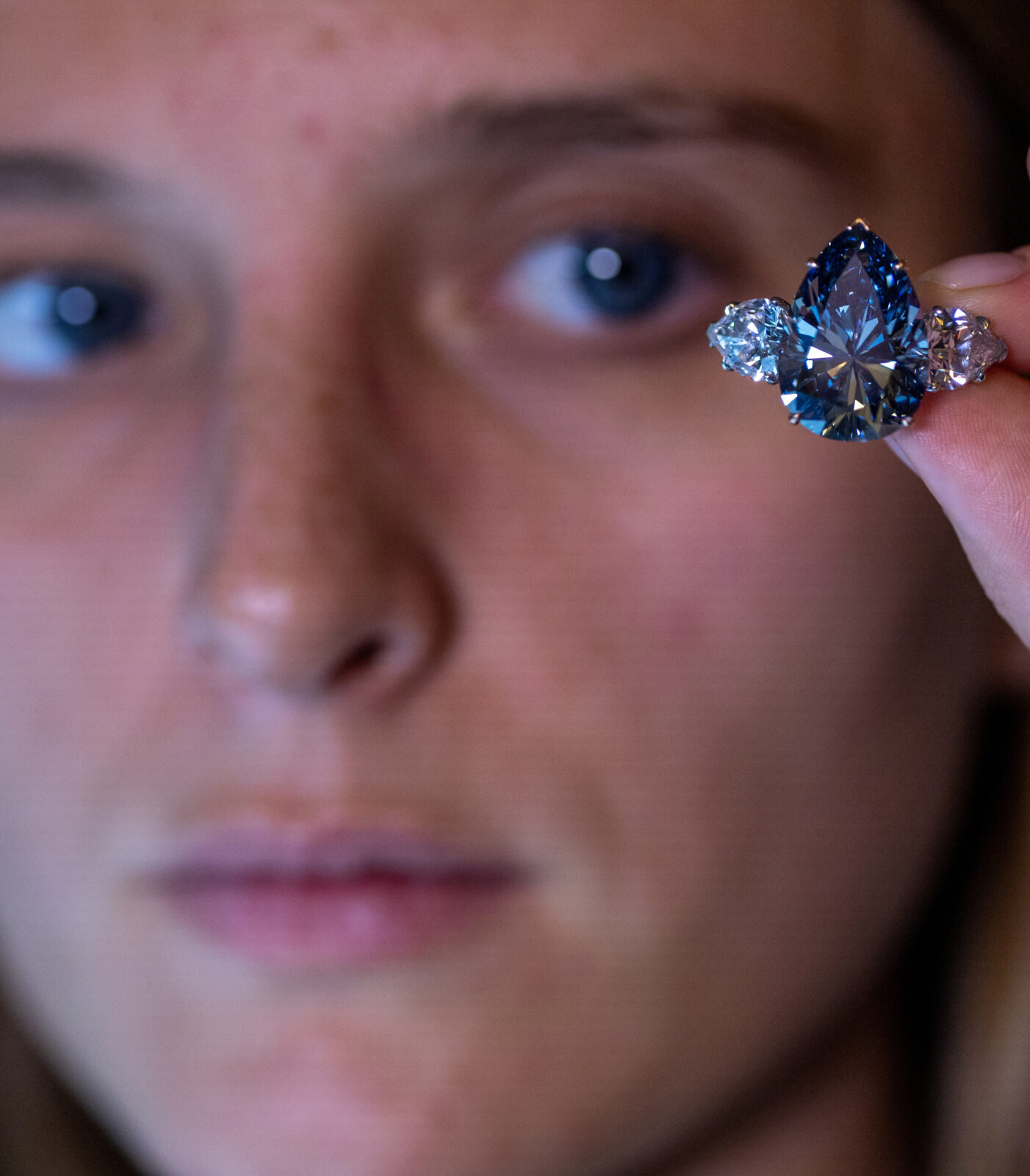 Chiadini holds the “Bleu Royal” diamond during an auction preview at Christie’s in Geneva