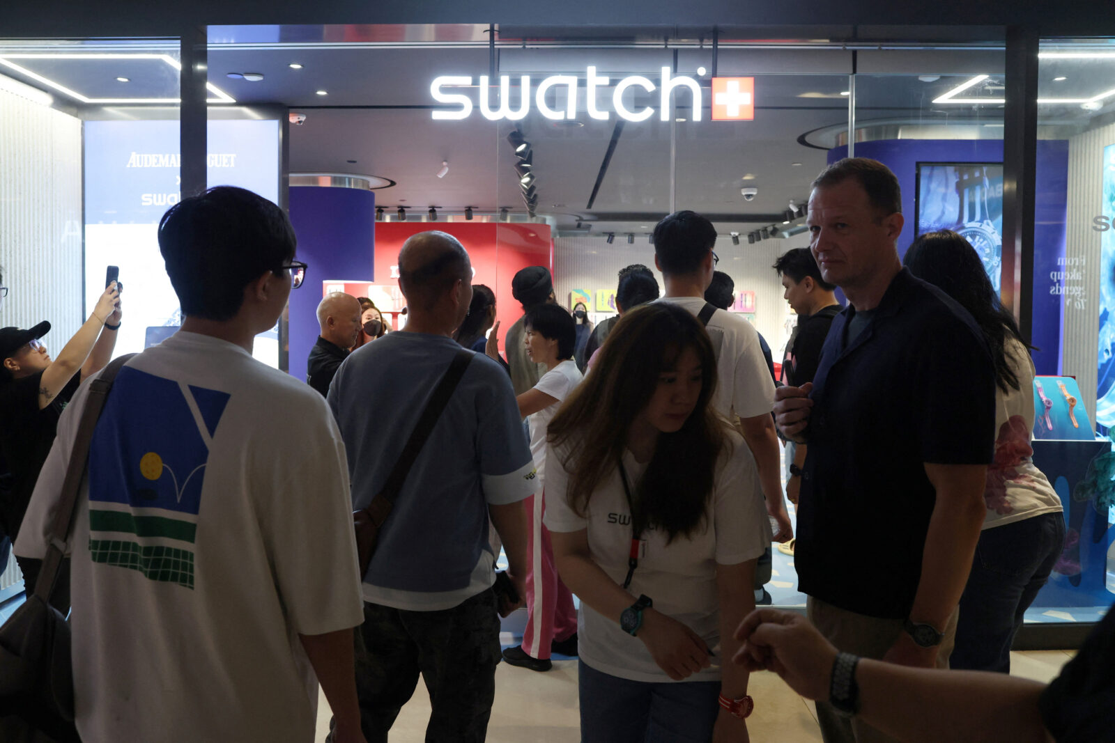 People queue up to buy the Audemars Piguet & Swatch “Royal Pop” watches in Singapore