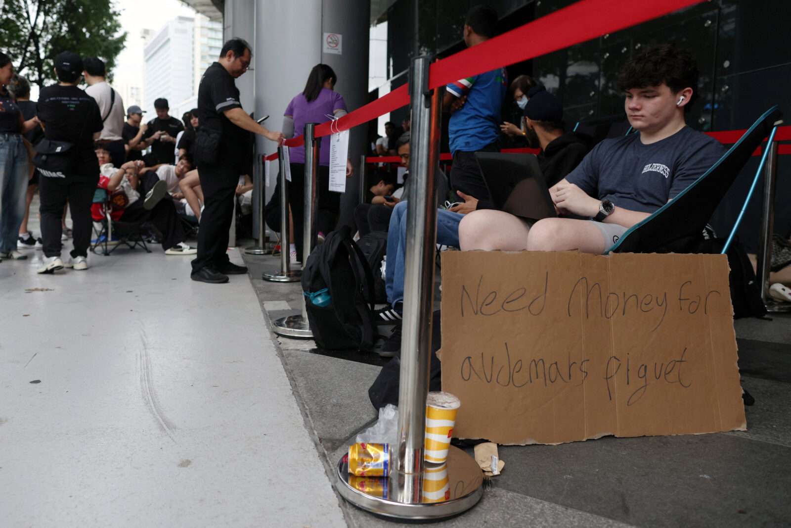 People queue to buy Audemars Piguet & Swatch “Royal Pop” watches in Singapore